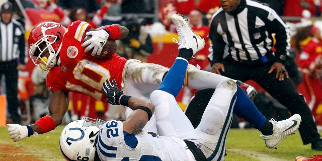 Kansas City Chiefs wide receiver Tyreek Hill (10) scores a touchdown past Indianapolis Colts safety Clayton Geathers (26) during the first half of an NFL divisional football playoff game in Kansas City, Mo., Saturday, Jan. 12, 2019. (Associated Press)