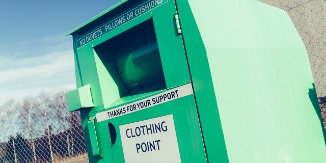 A woman found stuck partially inside a clothing donation bin was pronounced dead Tuesday, Toronto Police said.