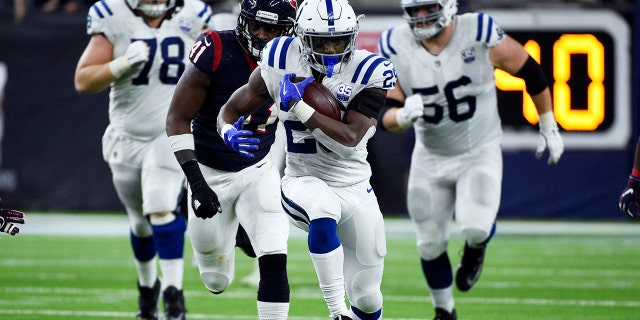 Indianapolis Colts running back Marlon Mack (25) runs against the Houston Texans during the second half of an NFL wild card playoff football game, Saturday, Jan. 5, 2019, in Houston. (Associated Press)