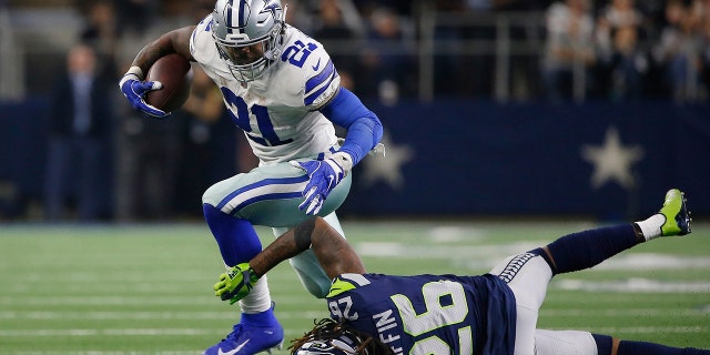 Dallas Cowboys running back Ezekiel Elliott (21) runs near Seattle Seahawks cornerback Shaquill Griffin (26) during the second half of the NFC wild-card NFL football game in Arlington, Texas, Saturday, Jan. 5, 2019. (Associated Press)