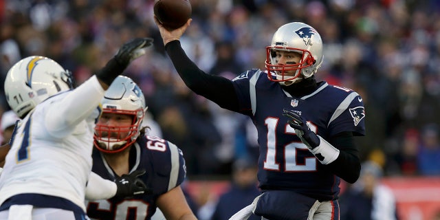 New England Patriots quarterback Tom Brady (12) passes under pressure from Los Angeles Chargers defensive end Damion Square (71) during the first half of an NFL divisional playoff football game, Sunday, Jan. 13, 2019, in Foxborough, Mass. (AP Photo/Charles Krupa)