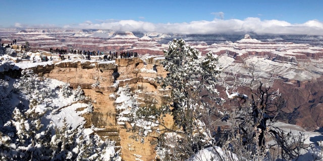 In this Tuesday, Jan. 1, 2019, photo, snow covers the Grand Canyon in Arizona.