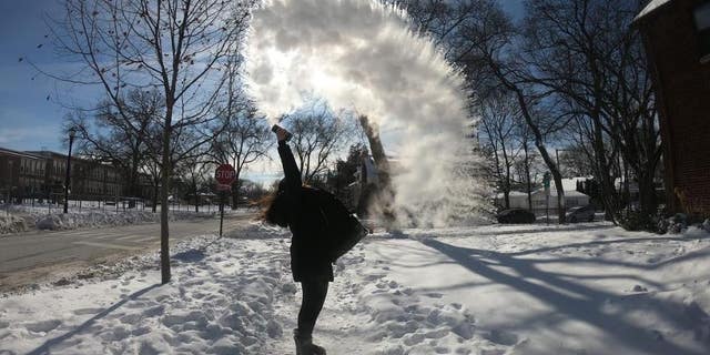 A woman participates in the "Boiling Water Challenge" in Evanston, Illinois.