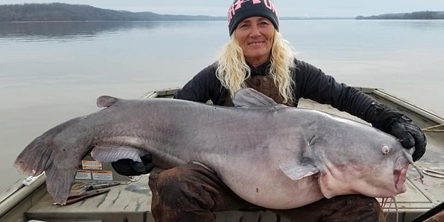 Paula Cathey Smith shows off her massive catch.