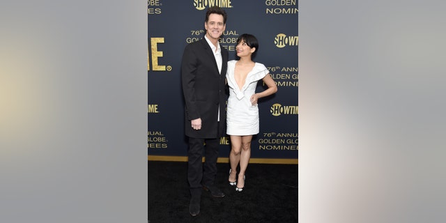 WEST HOLLYWOOD, CA - JANUARY 05: Jim Carrey and Ginger Gonzaga attend the Showtime Golden Globe Nominees Celebration at Sunset Tower Hotel on January 5, 2019 in West Hollywood, California. (Photo by Gregg DeGuire/Getty Images)