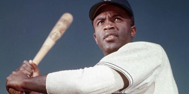 Brooklyn Dodger Jackie Robinson poses in his batting stance. Robinson broke baseball's color barrier when he joined the Dodgers in April 1947, going on to be named National League Rookie of the Year. Two years later, Robinson was named National League Most Valuable Player.