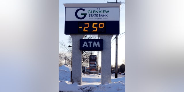 A sign shows the current outdoor temperature in Glenview, Ill., Wednesday, Jan. 30, 2019.