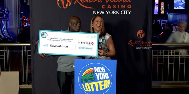 Powerball winner David Johnson collects his prize. (New York Lottery)