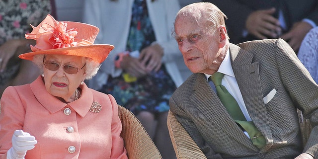 Queen Elizabeth II and The Duke of Edinburgh during the polo at the Guards Polo Club, Windsor Great Park, Egham, Surrey. 