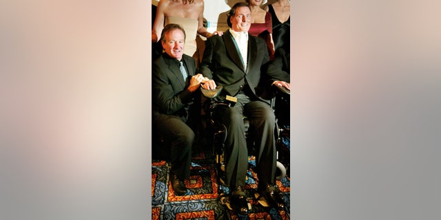 Christopher Reeve with pal Robin Williams. — Reuters