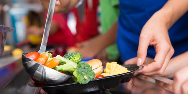 A closeup of vegetables that are served in a school lunch line is shown here.