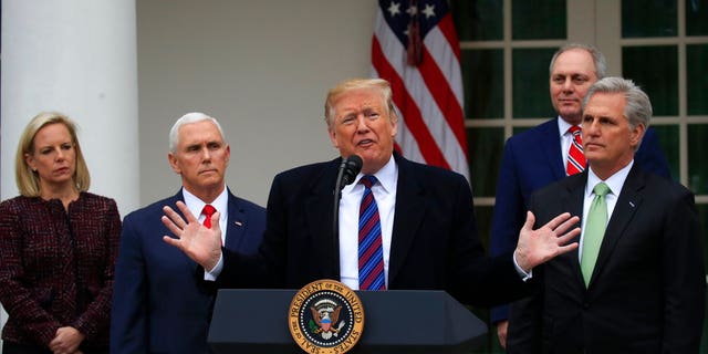 President Donald Trump speaks in the Rose Garden of the White House in Washington, after a meeting with Congressional leaders on border security, as the government shutdown continues Friday, Jan. 4, 2019, as Homeland Security Secretary Kirstjen Nielsen, Vice President Mike Pence, House Minority Whip Steve Scalise of La., and House Minority Leader Kevin McCarthy of Calif., listen. (AP Photo/Manuel Balce Ceneta)