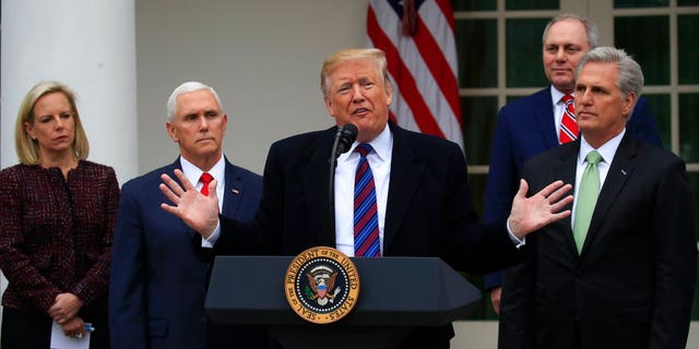 President Donald Trump speaks in the Rose Garden of the White House in Washington, after a meeting with Congressional leaders on border security, as the government shutdown continues Friday, Jan. 4, 2019, as Homeland Security Secretary Kirstjen Nielsen, Vice President Mike Pence, House Minority Whip Steve Scalise of La., and House Minority Leader Kevin McCarthy of Calif., listen. (AP Photo/Manuel Balce Ceneta)