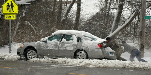 Multiple deaths on snow-slicked roads were reported in the Midwest as a winter storm swept the region this weekend, snarling traffic in several states and leaving thousands without power.