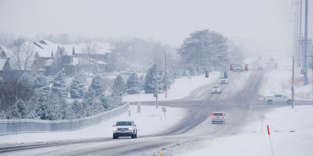 A massive winter snowstorm moved into Kansas and Nebraska from the Rockies on Friday, then east into Missouri, Iowa, Illinois and Indiana, covering roads and making driving dangerous.