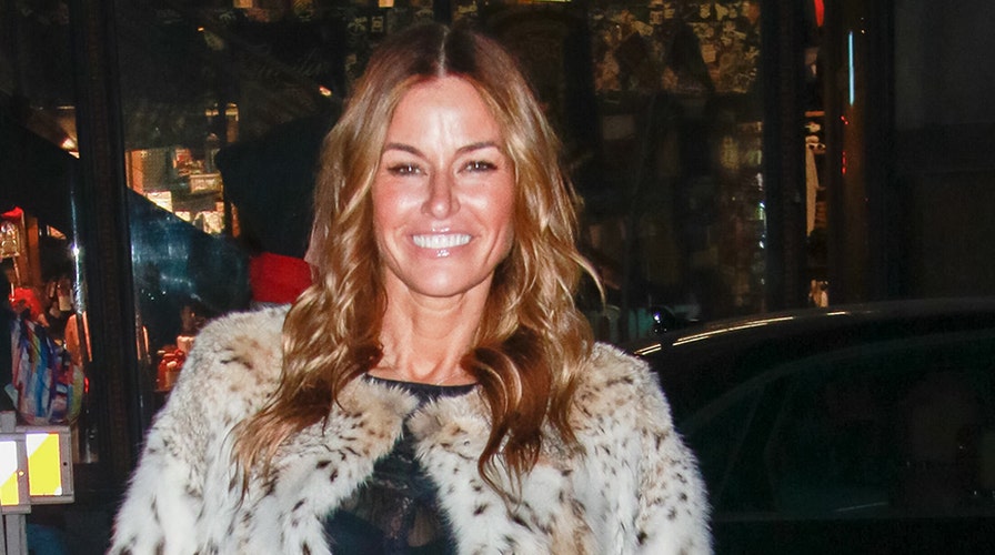 Model Kelly Bensimon 51 shows off her toned legs in all white