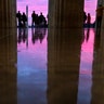 Spectators watch the first sunrise of the new year from the steps of the Lincoln Memorial in Washington, Jan. 1, 2019. 