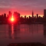 The sun rises down 42nd Street during a Manhattanhenge sunrise in New York City, Jan. 12, 2019. 