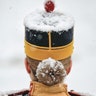 Snow falls on an honor guard soldier before the welcoming ceremony for Slovenia's President Borut Pahor at the Cotroceni presidential palace in Bucharest, Romania, Jan. 15, 2019.