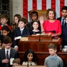 Nancy Pelosi of California, surrounded by her grandchildren and children of representatives takes the oath to become Speaker of the House in Washington, Jan. 3, 2019. 