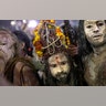Indian Sadhus, or Hindu holy men, covered in ash walk before taking a ritualistic dip on auspicious Makar Sankranti day during the Kumbh Mela, or pitcher festival in Prayagraj, Uttar Pradesh state, India, Jan. 15, 2019. 