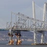 A section of the old Tappan Zee Bridge is brought down with explosives in this view from Tarrytown, N.Y., Jan. 15, 2019. 