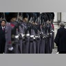 Britain's Prime Minister Theresa May walks with Japan's Prime Minister Shinzo Abe during a military guard of honor in London, Jan. 10, 2019. 