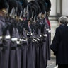 Britain's Prime Minister Theresa May walks with Japan's Prime Minister Shinzo Abe during a military guard of honor in London, Jan. 10, 2019. 