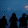 Skywatchers across the globe enjoyed the rare phenomenon of the super blood Moon. Here, people watch the supermoon rise behind the downtown Los Angeles skyline, from Kenneth Hahn Park in Los Angeles, Sunday, Jan. 20, 2019.