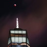 The super blood Moon visible above One World Trade Center in downtown Manhattan.