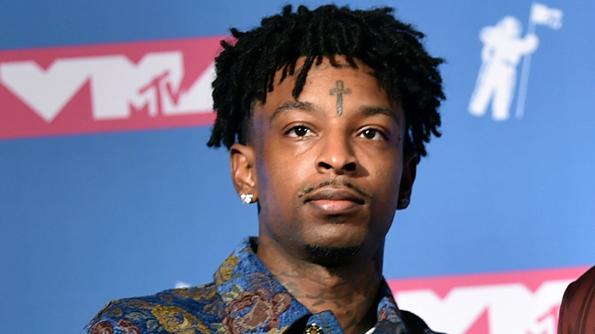 CORRECTS RELEASE DATE - FILE - In this Aug. 20, 2018, file photo, 21 Savage poses in the press room at the MTV Video Music Awards at Radio City Music Hall in New York. A lawyer for rapper 21 Savage said Tuesday, Feb. 12, 2019, that he has been granted bond for release from federal immigration custody, but the bond was granted too late Tuesday for him to be released right away. He said he anticipates the rapper, whose given name is She'yaa Bin Abraham-Joseph, will be released Wednesday, Feb. 13. (Photo by Evan Agostini/Invision/AP, File)