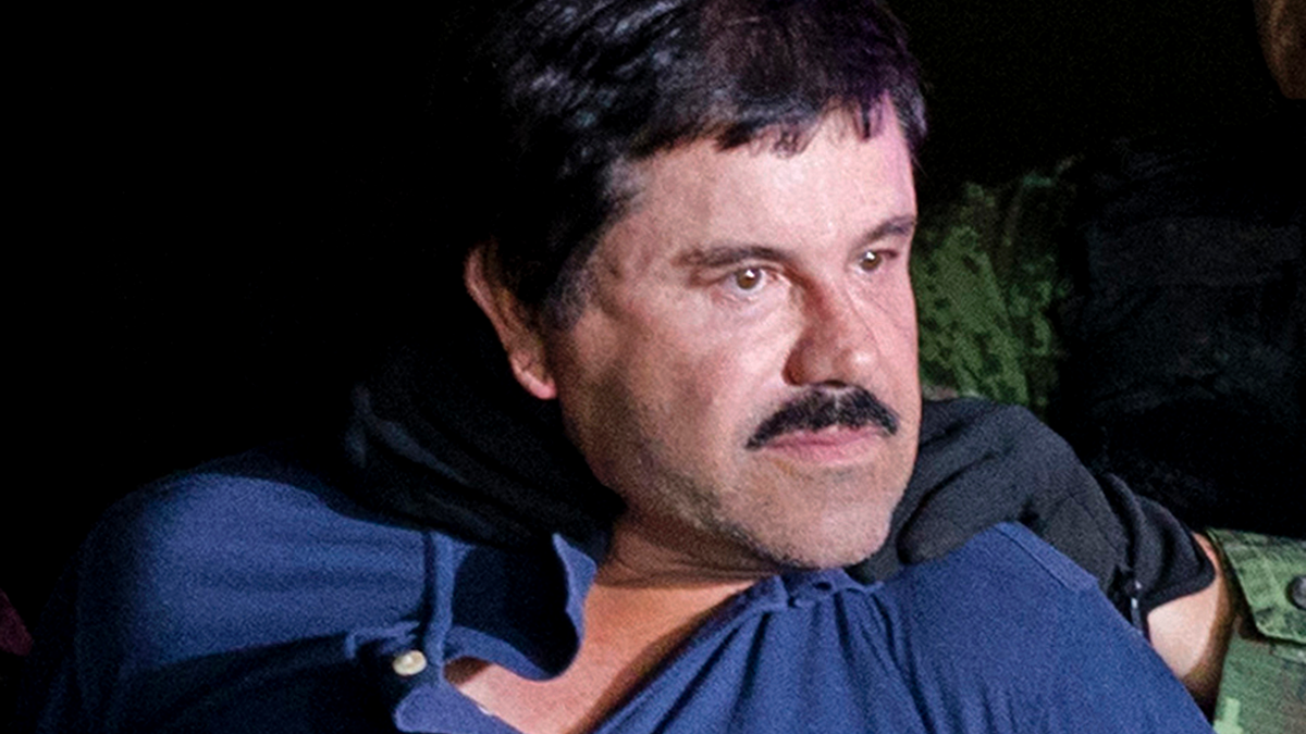 Joaquin "El Chapo" Guzman is made to face the media in Mexico City as he is escorted by Mexican soldiers following his recapture six months after escaping from a maximum security prison. The notorious Mexican drug lord was convicted of drug-trafficking charges, Tuesday, Feb. 12 2019, in federal court in New York. (AP Photo/Eduardo Verdugo, File)