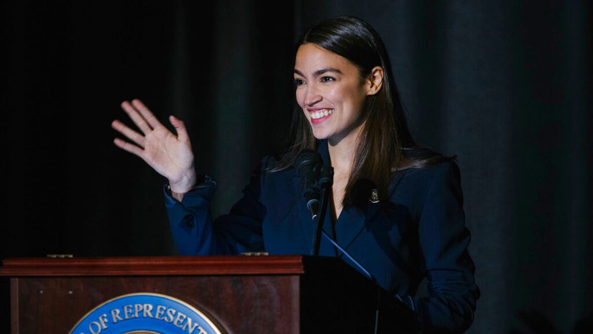 Rep. Alexandria Ocasio-Cortez, D-N.Y., delivers her inaugural address following her swearing-in ceremony at the Renaissance School for Musical Theater and Technology in the Bronx borough of New York on Saturday, Feb. 16, 2019. (AP Photo/Kevin Hagen)