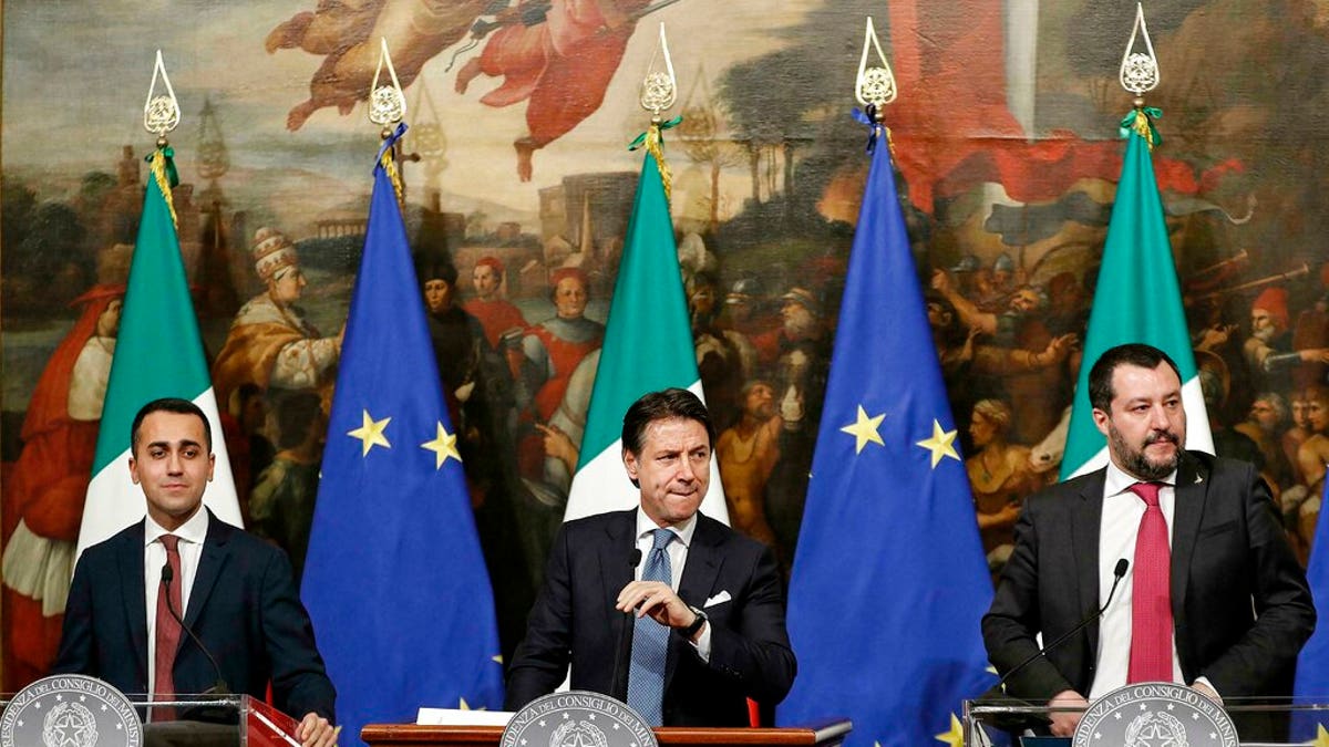 Italian Premier Giuseppe Conte, center, Deputy Premier and Labour and Industry Minister Luigi Di Maio, left, and Deputy Premier and Interior Minister, Matteo Salvini, attend a press conference following a Cabinet meeting at Chigi Palace's premier office in Rome, Thursday, Jan. 17, 2019.
