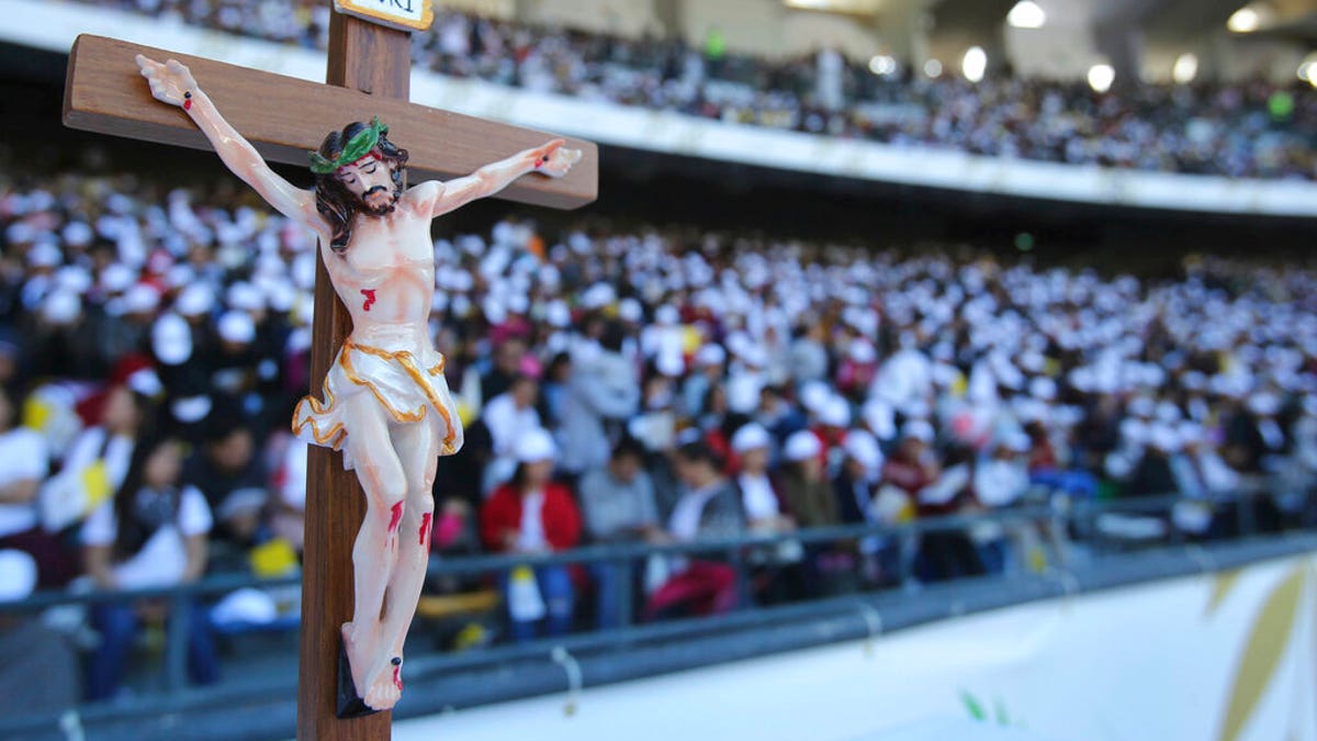 Worshippers attend Pope Francis Mass at the Sheikh Zayed Sports City in Abu Dhabi, United Arab Emirates.