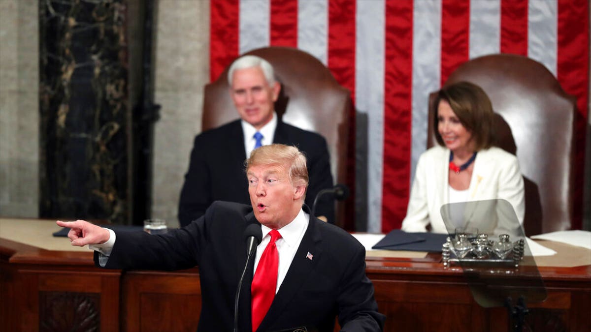 President Donald Trump acknowledges women in Congress as he delivers his State of the Union address to a joint session of Congress on Capitol Hill in Washington, as Vice President Mike Pence and Speaker of the House Nancy Pelosi, D-Calif., watch, Tuesday, Feb. 5, 2019. (AP Photo/Andrew Harnik)