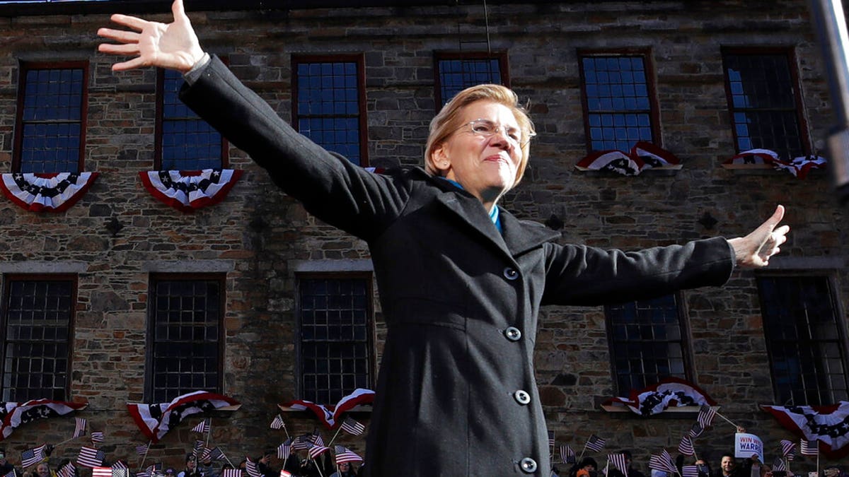 Sen. Elizabeth Warren, D-Mass., acknowledges cheers as she takes the stage during an event to formally launch her presidential campaign, Saturday, Feb. 9, 2019, in Lawrence, Mass. (AP Photo/Elise Amendola)