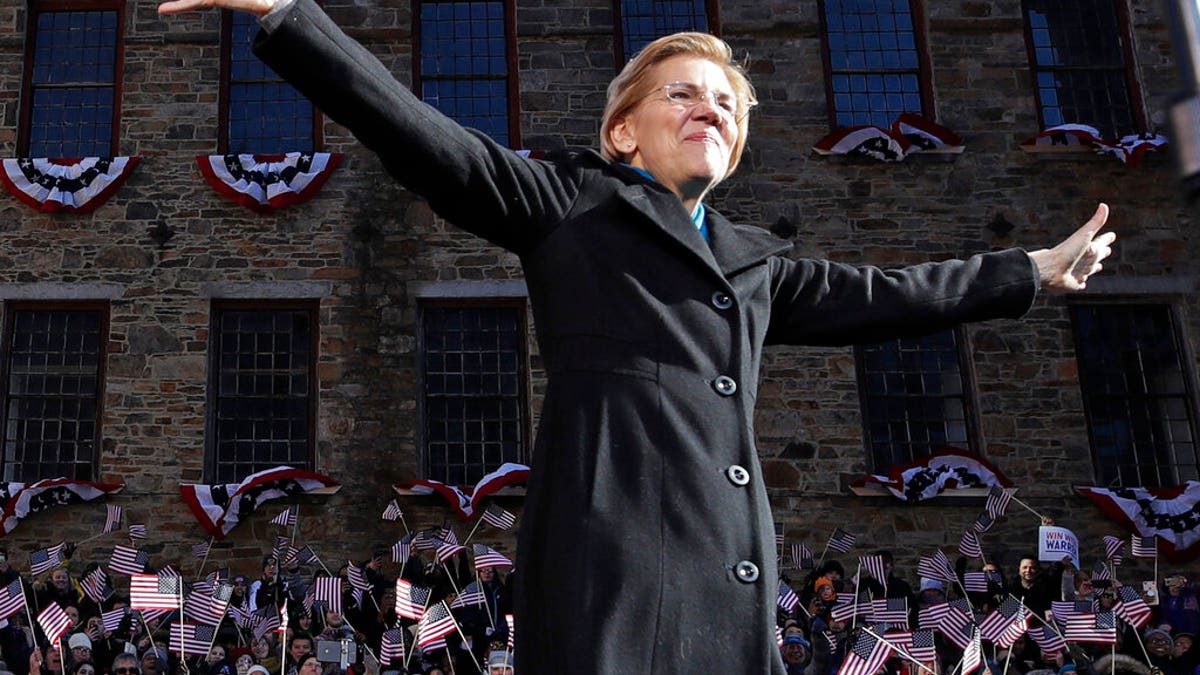 Sen. Elizabeth Warren, D-Mass., acknowledges cheers as she takes the stage during an event to formally launch her presidential campaign, Saturday, Feb. 9, 2019, in Lawrence, Mass. (AP Photo/Elise Amendola)