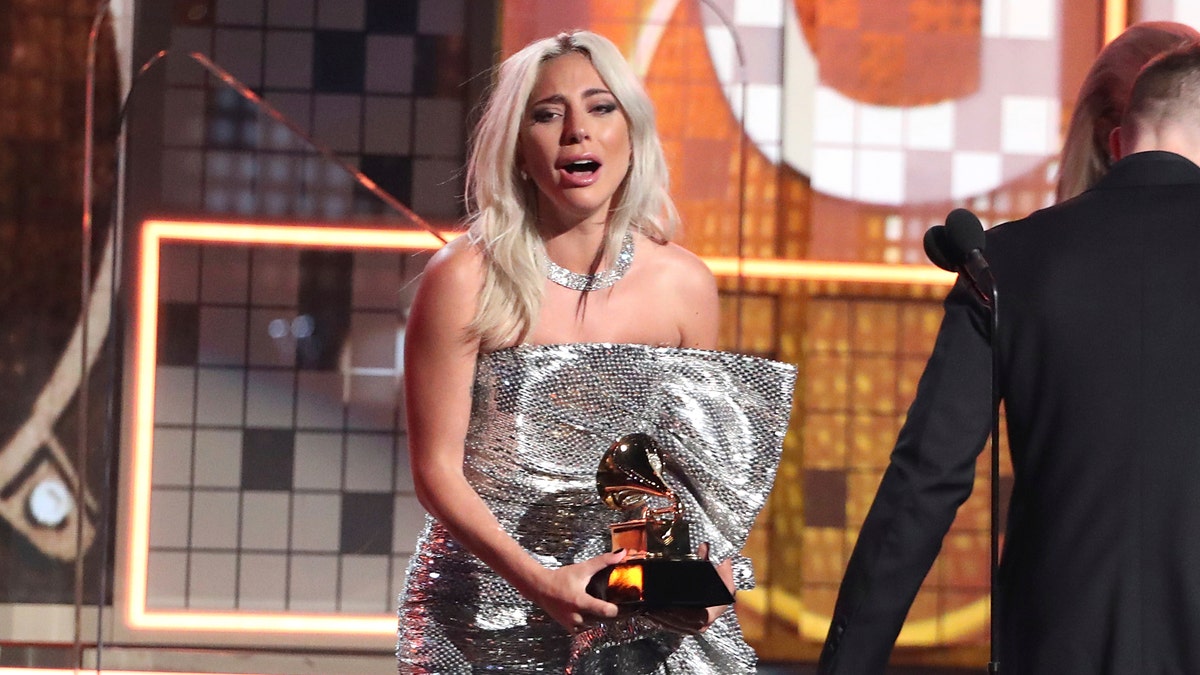 Lady Gaga reacts before accepting the award for best pop duo or group performance for "Shallow" at the 61st annual Grammy Awards on Sunday, Feb. 10, 2019, in Los Angeles.