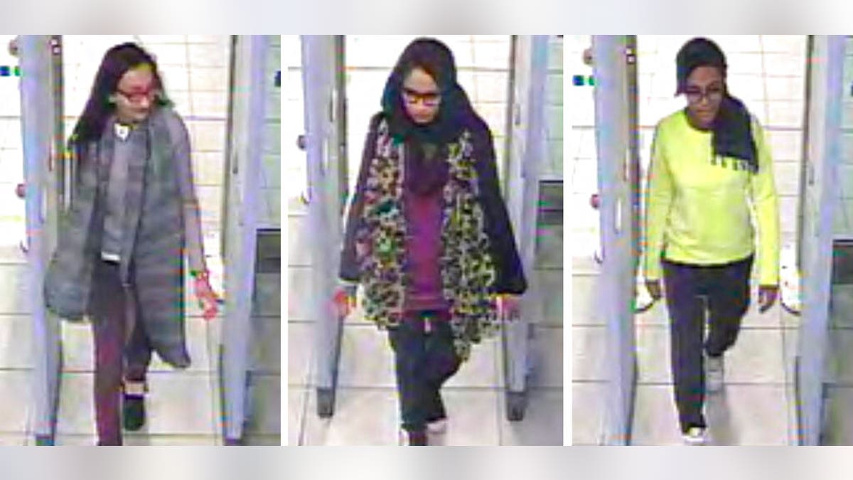 FILE - This Monday Feb. 23, 2015 file handout image of a three image combo of stills taken from CCTV issued by the Metropolitan Police shows Kadiza Sultana, left, Shamima Begum, center, and Amira Abase going through security at Gatwick airport, south England, before catching their flight to Turkey. Shamima Begum told The Times newspaper in a story published Thursday Feb. 14, 2019, that she wants to come back to London. (Metropolitan Police via AP)