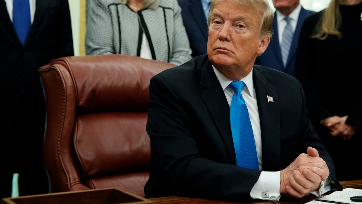 President Trump regularly mocks The New York Times, but the paper helped confirm his claim that tape is used to silence women crossing the border. (AP Photo/ Evan Vucci)