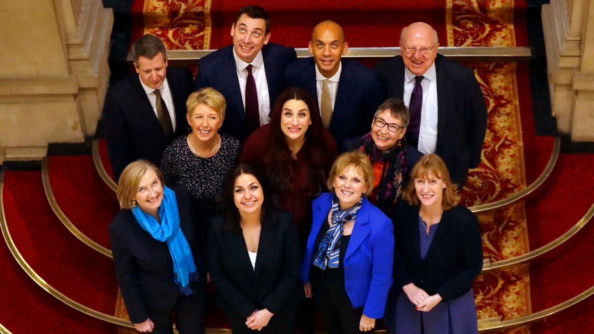 Eleven British politicians who have joined new political party 'The Independent Group' pose for a photograph after a press conference in Westminster in London, Wednesday, Feb. 20, 2019. 