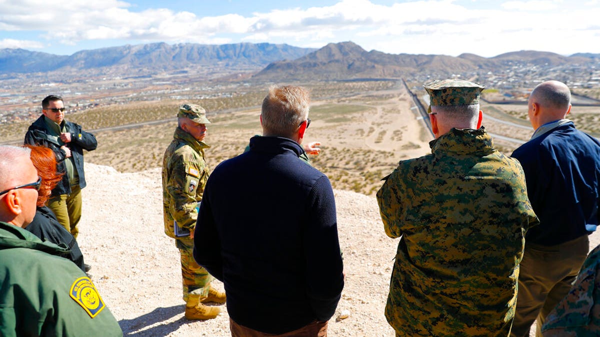 Acting Secretary of Defense Patrick Shanahan, center, and Joint Chiefs Chairman Gen. Joseph Dunford, second from the right, during a tour of the U.S.-Mexico border at Santa Teresa Station in Sunland Park, N.M., on Saturday. (AP Photo/Pablo Martinez Monsivais)