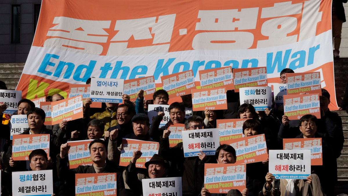 South Korean protesters shout slogans during a rally demanding the end the Korean War and to stop the sanction on North Korea near the U.S. embassy in Seoul, South Korea, Tuesday, Feb. 26, 2019. (AP Photo/Lee Jin-man)