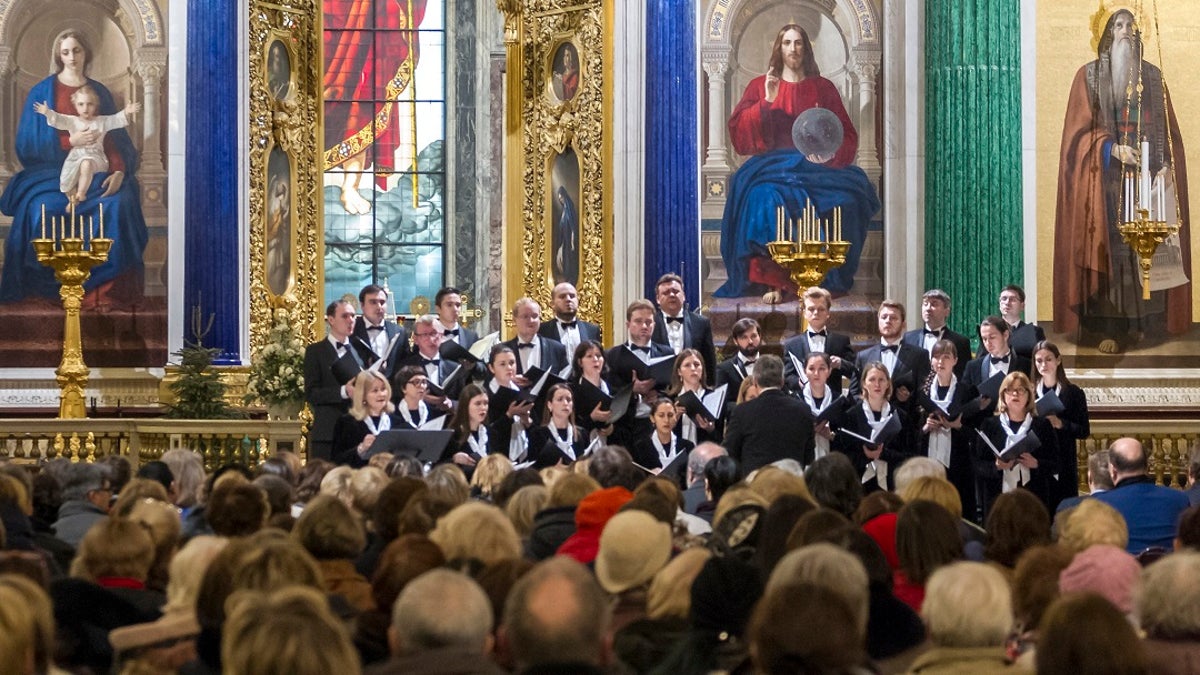 FILE 2018: Concert Choir performs at the St. Isaac's Cathedral in St. Petersburg, Russia. A choir in the Russian city of St. Petersburg has drawn criticism for performing a satirical song about firing a missile on the United States from a Soviet nuclear submarine. (Roman Pimenov, Interpress photo agency via AP)