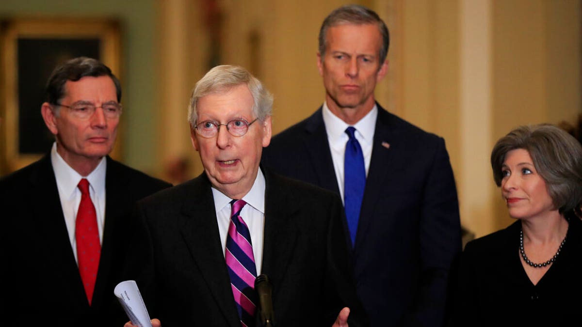Senate Majority Leader Mitch McConnell, R-Ky., with, from left, Sens. John Barrasso, R-Wyo., McConnell, John Thune, R-S.D., and Joni Ernst, R-Iowa, speaks to reporters on Capitol Hill in Washington, Feb. 26, 2019. (AP Photo/Manuel Balce Ceneta)