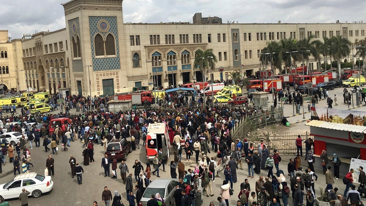 People gather outside Ramsis train station in Cairo, Egypt, Wednesday, Feb. 27, 2019. (AP Photo/Nariman El-Mofty)