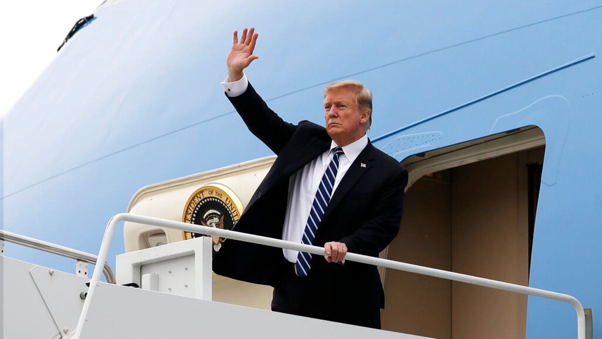President Donald Trump waves as he boards Air Force One after a summit with North Korean leader Kim Jong Un, Thursday, Feb. 28, 2019, in Hanoi. (AP Photo/ Evan Vucci)