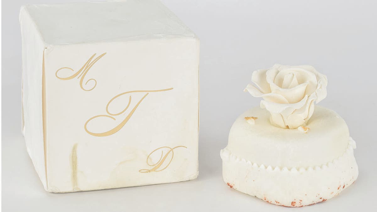 The 14-year-old sweet for sale comes packaged in its original ivory box, stamped with a gold monogram “MDT.” 