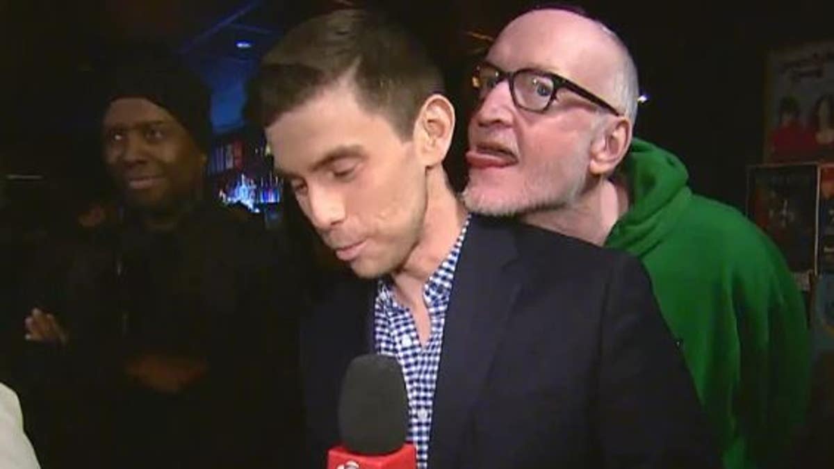 A Canadian actor and comedian was seen in a video appearing to lick a reporter during a live hit.